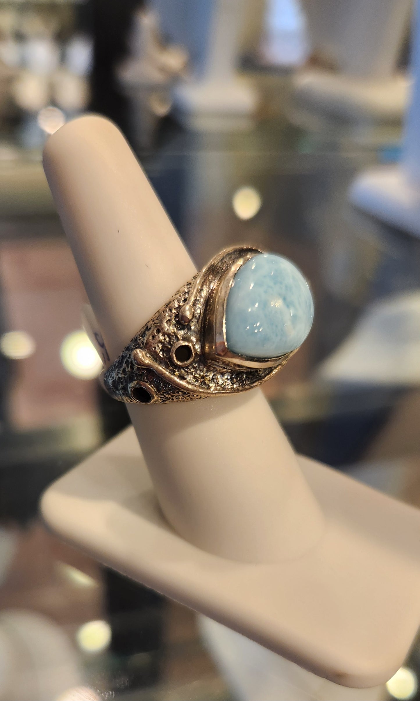 Sterling silver ring with sideways pear-shaped larimar cabochon