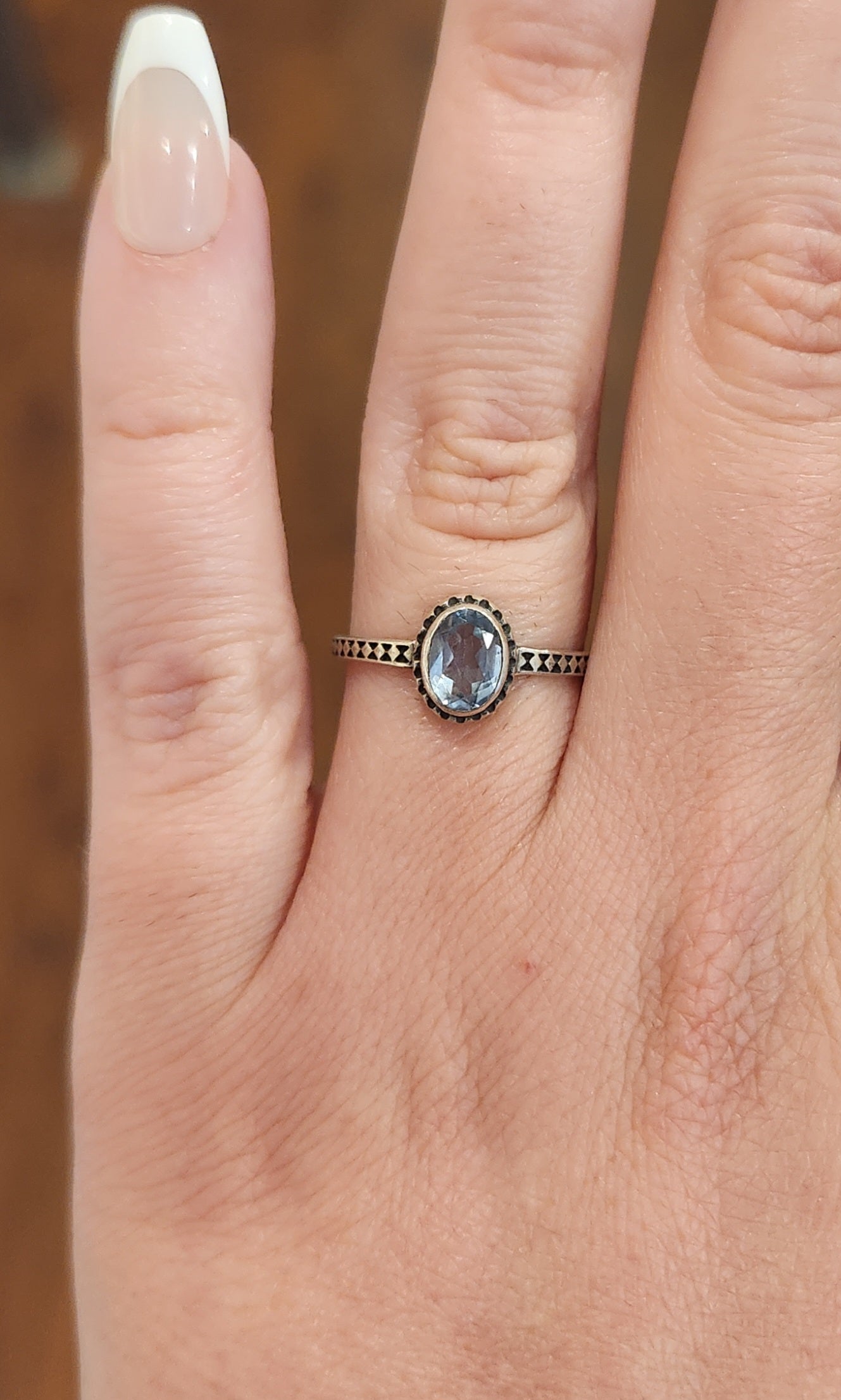 Sterling silver faceted oval blue topaz ring