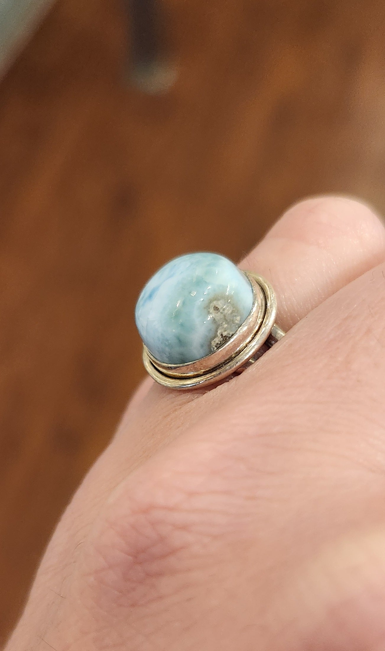 Sterling silver ring with round larimar cabochon