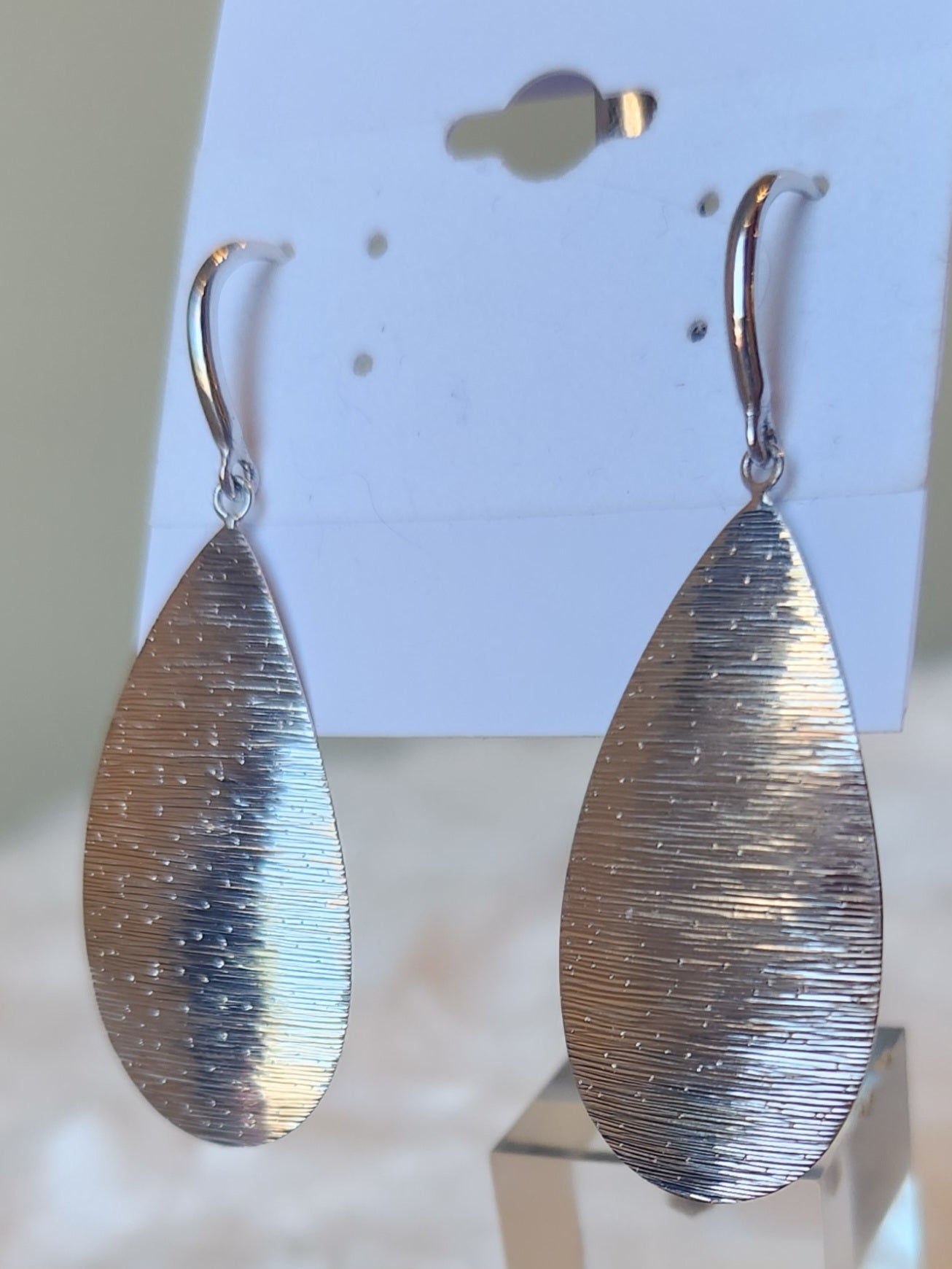 Sterling silver dangle pear-shaped textured earrings