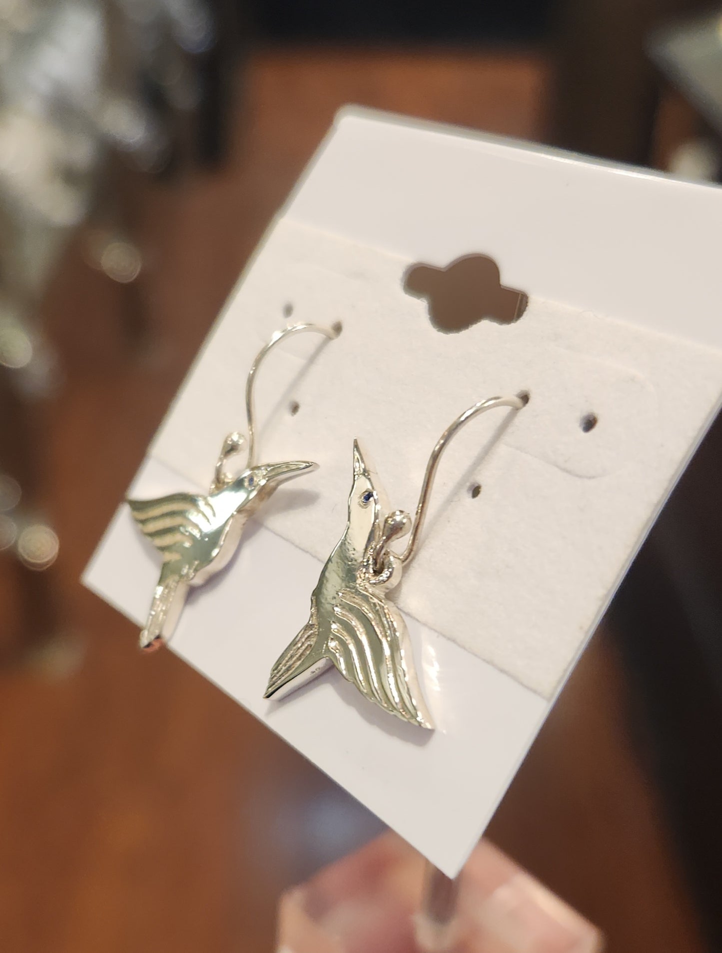 Sterling silver handmade hummingbird earrings with blue sapphires