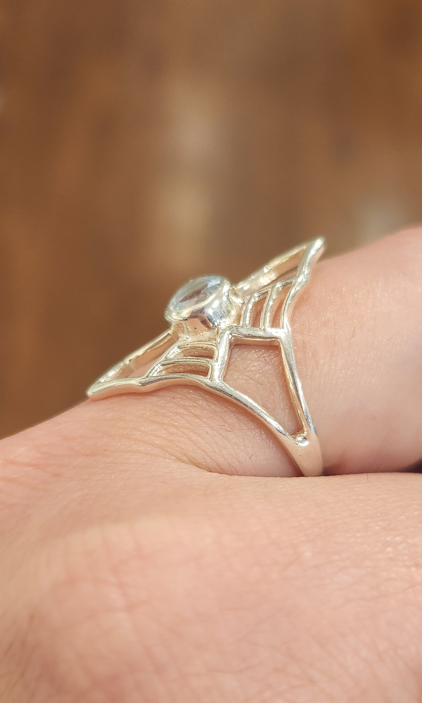 Sterling silver blue topaz spider-web ring